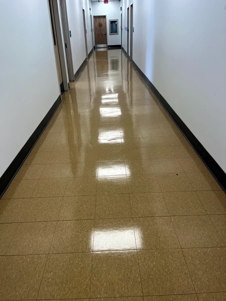 Office hallway floor after stripping and refinishing
